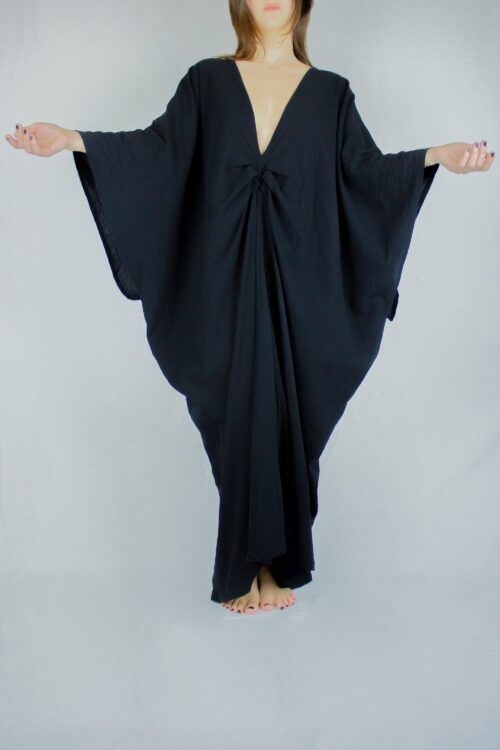 Woman wearing the organic Goddess Dress in black by Carmen Calburean