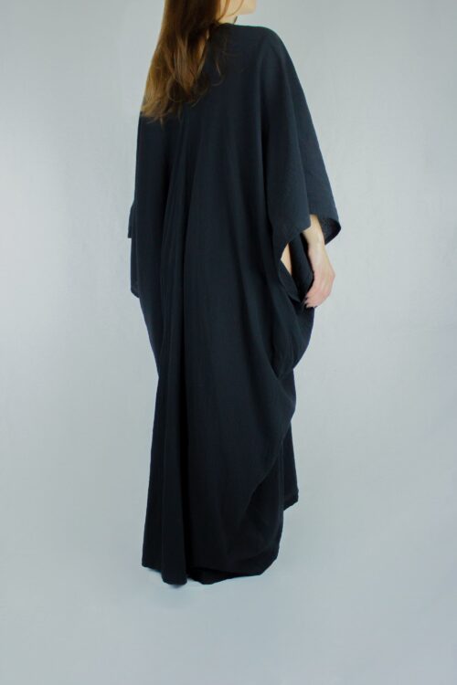 Woman wearing the organic Goddess Dress in black by Carmen Calburean