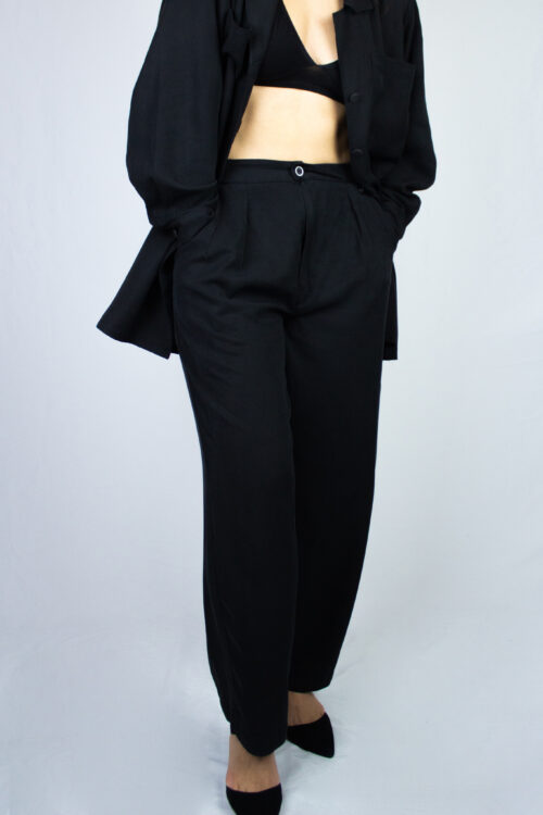 Woman wearing black Kosu pants by Carmen Calburean