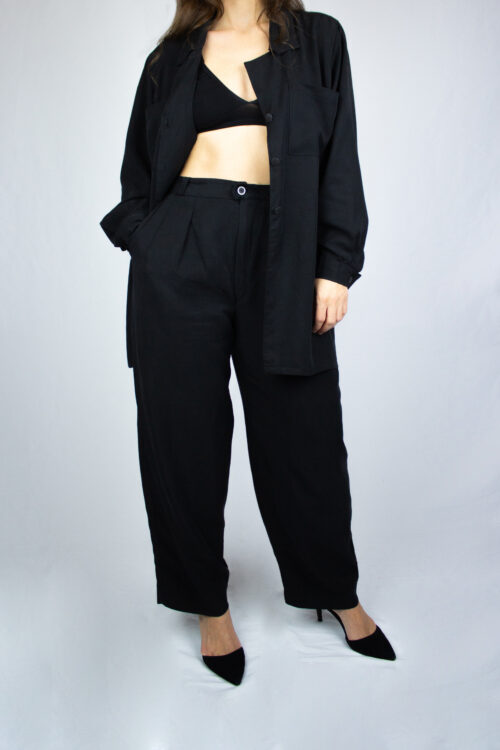 Woman wearing black Kosu pants by Carmen Calburean